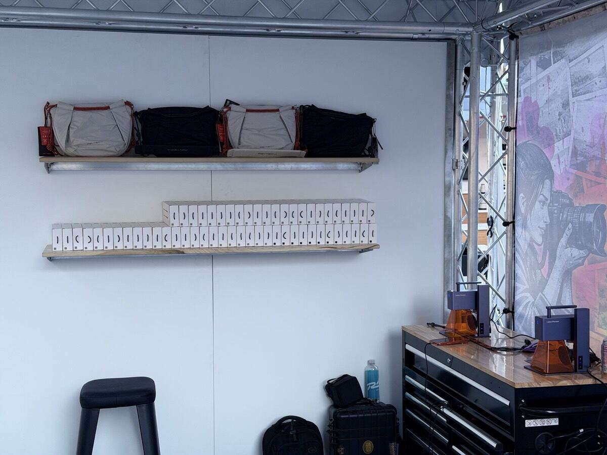 Shelf of welcome-kit swag pieces staged before an event opens